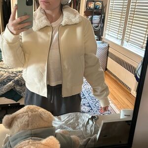 Full zip cream coat with two front pockets